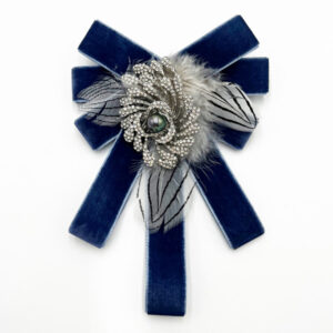Romantic, tails down bow brooch in blue