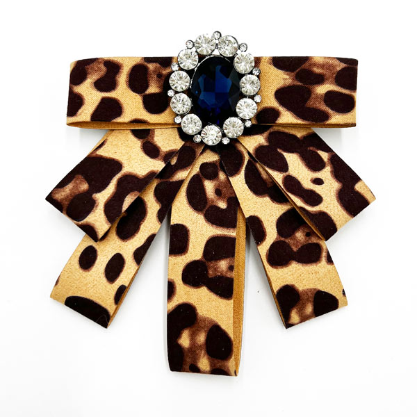 Sophisticated tails down bow brooch in animal print